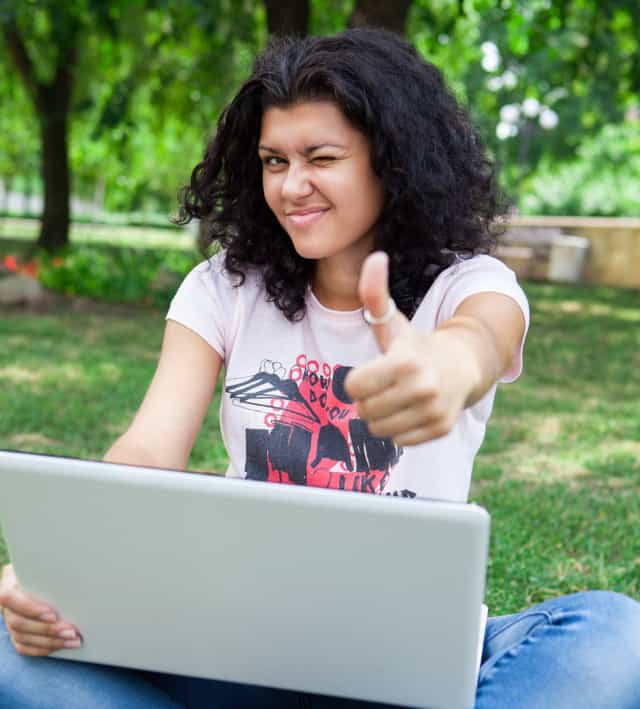 Girl on Laptop in Park