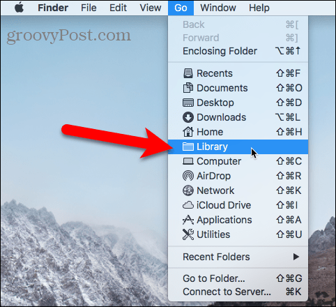 Access the Library folder using the Go menu in Finder on Mac