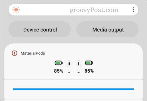 The Materialpods app showing AirPods battery status in the notification area on Android